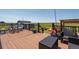 Expansive deck offering comfortable seating and stunning views of the surrounding landscape at 11809 Pass Me By Rd, Strasburg, CO 80136