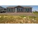 Charming single-story home with gray siding, white trim, and a well-kept yard at 11809 Pass Me By Rd, Strasburg, CO 80136