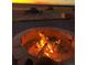Cozy fire pit area with glowing flames and a relaxing ambiance at 11809 Pass Me By Rd, Strasburg, CO 80136
