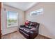 Cozy room with comfortable leather recliner in a peaceful, sunlit space at 11809 Pass Me By Rd, Strasburg, CO 80136