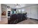 Cozy living room with a leather sofa, built-in shelving, and a view at 11809 Pass Me By Rd, Strasburg, CO 80136
