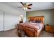 Spacious main bedroom features a decorative bed frame and a connecting bathroom at 11809 Pass Me By Rd, Strasburg, CO 80136