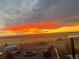 Scenic fire pit view at sunset with desert landscape in the background at 11809 Pass Me By Rd, Strasburg, CO 80136