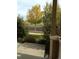Landscaped front yard featuring trees, shrubs, and a view of the street, offering a welcoming and aesthetically pleasing entrance at 15594 E 97Th Ave, Commerce City, CO 80022
