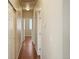 Hallway boasts wood floors and several doors at 15594 E 97Th Ave, Commerce City, CO 80022