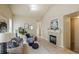 Bright living room boasts a fireplace, tile floors, and comfortable seating at 15594 E 97Th Ave, Commerce City, CO 80022