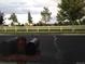 Neighborhood street view with mailboxes and a white fence, capturing the peaceful and friendly atmosphere of the community at 15594 E 97Th Ave, Commerce City, CO 80022