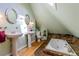 Bathroom features two sinks, a soaking tub, and natural light from a skylight at 233 W 3Rd Ave, Denver, CO 80223