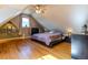 Bright bedroom features hardwood floors, a ceiling fan, and a window with natural light at 233 W 3Rd Ave, Denver, CO 80223