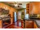 Cozy kitchen features wooden cabinets, stainless steel appliances, and granite countertops at 233 W 3Rd Ave, Denver, CO 80223