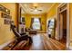Spacious living room showcasing hardwood floors, a cozy fireplace, and large windows for natural light at 233 W 3Rd Ave, Denver, CO 80223
