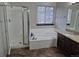 This bathroom features a shower, soaking tub, and vanity at 2238 S Nile Ct, Aurora, CO 80014