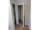 Hallway view to half-bath with walk-in closet and bedroom at 2238 S Nile Ct, Aurora, CO 80014