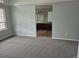 Bedroom boasts neutral walls, light carpet, and an open entrance to the bathroom and a closet area at 2238 S Nile Ct, Aurora, CO 80014