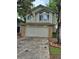 Charming two-story home featuring a brick-accented two-car garage and a well-maintained front yard at 2238 S Nile Ct, Aurora, CO 80014