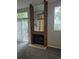 Cozy living room with a brick fireplace and sliding glass doors that open to the outside at 2238 S Nile Ct, Aurora, CO 80014