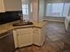 Modern kitchen featuring stainless steel appliances, granite countertops, and ample cabinet space at 2238 S Nile Ct, Aurora, CO 80014