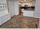 Modern kitchen featuring stainless steel appliances, granite countertops, and ample cabinet space at 2238 S Nile Ct, Aurora, CO 80014