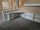 View of living room featuring a built-in desk area with shelving, offering a functional and stylish workspace at 2238 S Nile Ct, Aurora, CO 80014