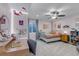 Bright bedroom featuring a desk, stylish decor, a comfy bed, and natural light at 4840 Point Mesa St, Castle Rock, CO 80108