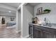 Finished basement wet bar area featuring a wine fridge, sink, granite counters, and popcorn machine at 4840 Point Mesa St, Castle Rock, CO 80108