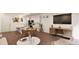 Modern kitchen with island and open living area with comfortable seating at 22311 E 38Th Pl, Aurora, CO 80019