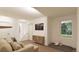 Spacious lower level rec room with plush seating and large window at 22311 E 38Th Pl, Aurora, CO 80019