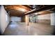 Unfinished basement with concrete floors, exposed ducts, and visible framing at 8387 Fig St, Arvada, CO 80005
