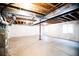 Bright unfinished basement with open ceiling and concrete floor at 8387 Fig St, Arvada, CO 80005