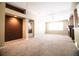 Spacious living room with a fireplace, large window, and seamless view into adjacent rooms at 8387 Fig St, Arvada, CO 80005