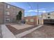 Backyard patio with gravel and a detached brick structure at 35-37 S Washington St, Denver, CO 80209