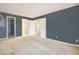 A bedroom leads to a bathroom and closet areas at 904 S Walden Way # 203, Aurora, CO 80017