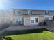 Spacious backyard with a patio area, artificial grass, and exterior view of the home at 6187 Wescroft Ave, Castle Rock, CO 80104