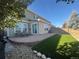 Inviting backyard with a patio, artificial grass, and a well-maintained fence at 6187 Wescroft Ave, Castle Rock, CO 80104