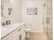 Elegant bathroom with a marble countertop, dual faucets, and a glass-enclosed shower showcasing luxurious finishes at 6187 Wescroft Ave, Castle Rock, CO 80104