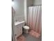 Cozy bathroom featuring a modern vanity, toilet, and shower with a pink curtain at 6187 Wescroft Ave, Castle Rock, CO 80104
