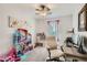 Bright bedroom with a ceiling fan, a computer desk and a doll house at 6187 Wescroft Ave, Castle Rock, CO 80104
