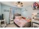 Comfortable bedroom featuring a cozy bed, side tables, and a playful princess theme at 6187 Wescroft Ave, Castle Rock, CO 80104