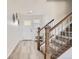 Inviting entryway with hardwood floors, staircase, and a white front door at 6187 Wescroft Ave, Castle Rock, CO 80104