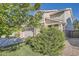 Exterior view of the home showcasing the side facade, landscaping, and attached two-car garage at 6187 Wescroft Ave, Castle Rock, CO 80104