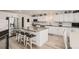 Modern kitchen featuring stainless steel appliances, a large island, and white cabinetry at 6187 Wescroft Ave, Castle Rock, CO 80104