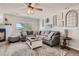 Comfortable living room with a fireplace, stylish decor, and ample natural light at 6187 Wescroft Ave, Castle Rock, CO 80104