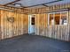 Spacious basement with wood paneling and exterior access at 6397 Ute Hwy, Longmont, CO 80503