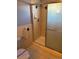 Clean bathroom with a shower and grab bar at 6397 Ute Hwy, Longmont, CO 80503