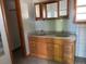 Bathroom with a double vanity and wood cabinets at 6397 Ute Hwy, Longmont, CO 80503