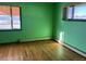 Bedroom with hardwood floors and a view at 6397 Ute Hwy, Longmont, CO 80503