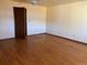 Spacious bedroom with hardwood floors and ample natural light at 6397 Ute Hwy, Longmont, CO 80503