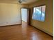 Bright bedroom featuring hardwood floors and a window at 6397 Ute Hwy, Longmont, CO 80503