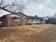 Single story home with stone exterior and large yard at 6397 Ute Hwy, Longmont, CO 80503