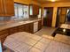 Kitchen features wood cabinets and tile countertops at 6397 Ute Hwy, Longmont, CO 80503
